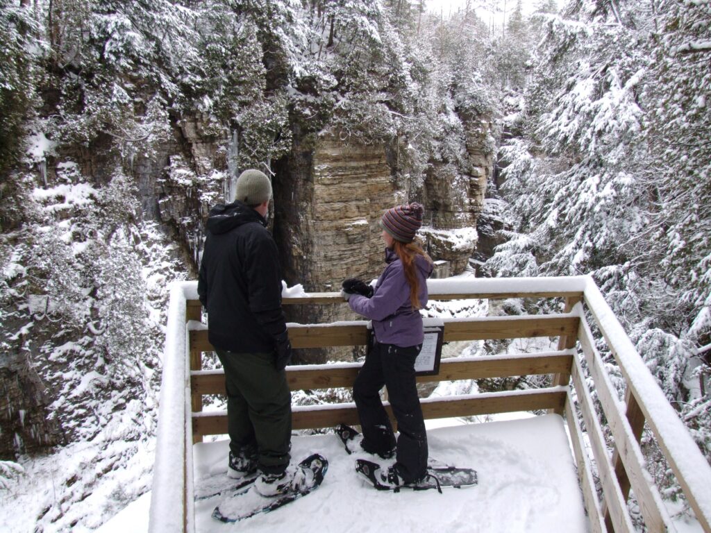 couple admiring the landscape of the Adirondack Mountains